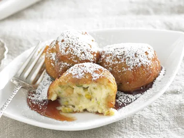 Ricotta fritters with lemon syrup