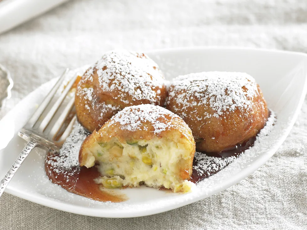 Ricotta fritters with lemon syrup