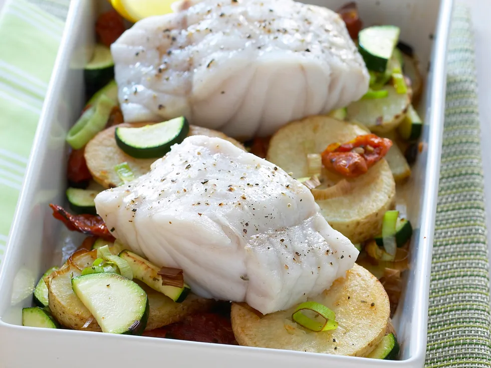 baked fish on potatoes