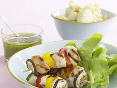 chicken and vegetable skewers with potato smash and pesto
