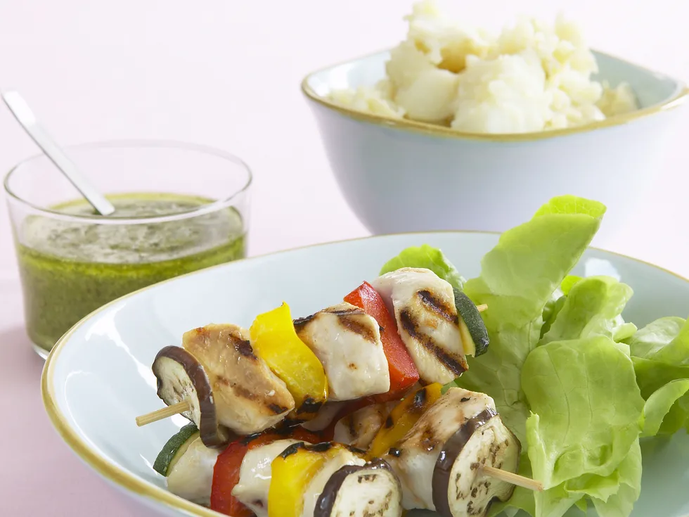 chicken and vegetable skewers with potato smash and pesto