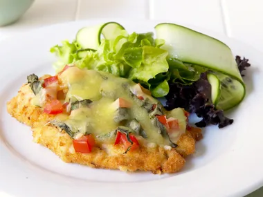 chicken schnitzel with tomato, basil and cheese