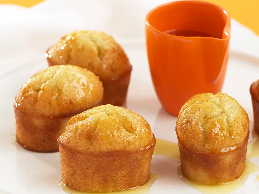 Orange and coconut syrup cakes