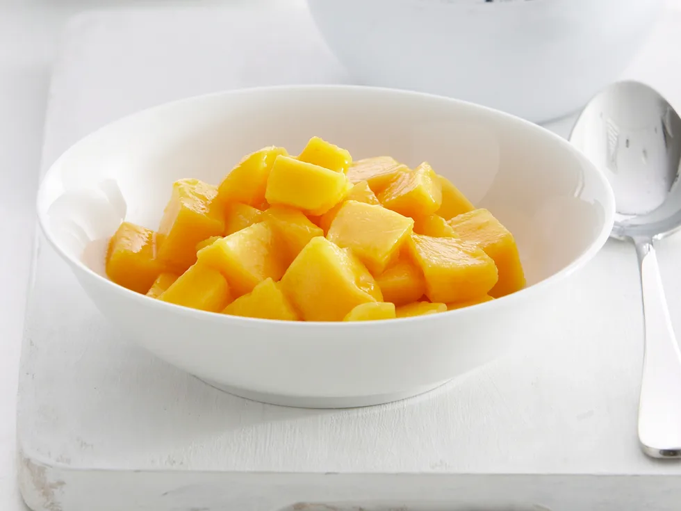 Coconut caramel sauce with vanilla ice-cream and mango