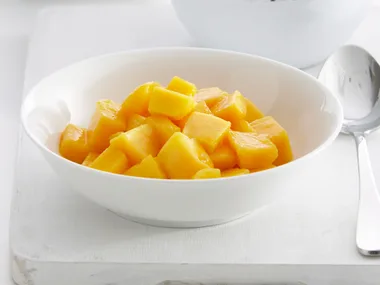 Coconut caramel sauce with vanilla ice-cream and mango