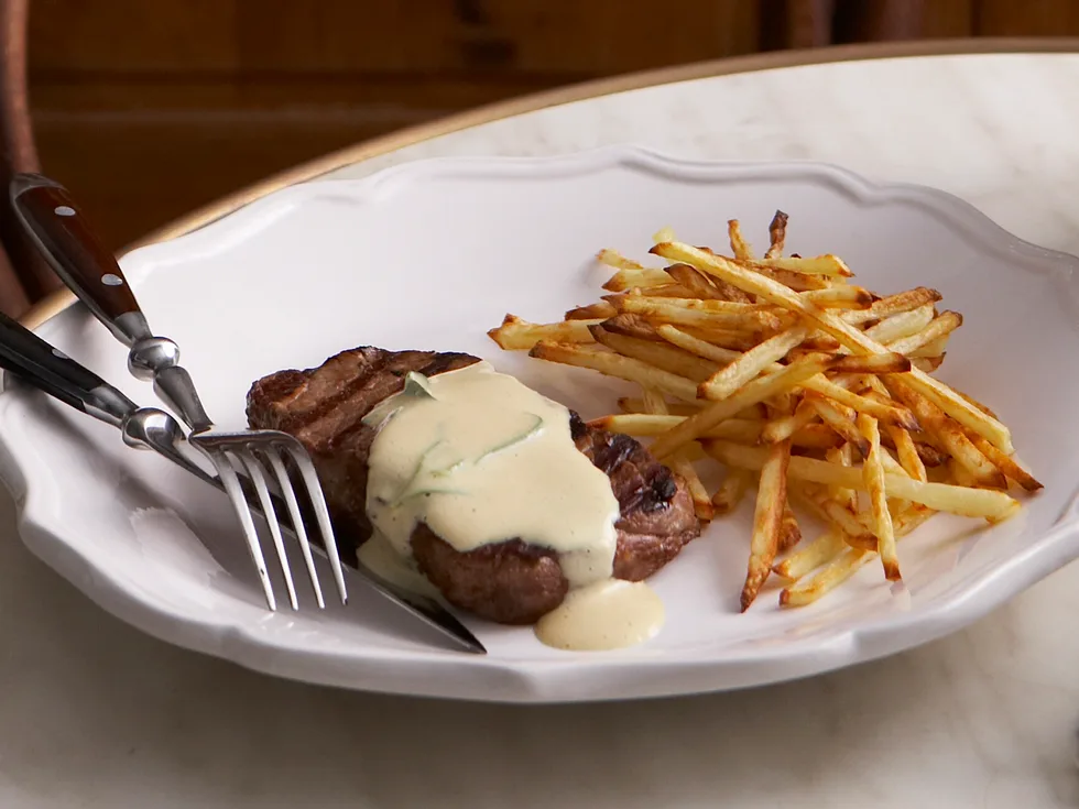 Grilled steak with mustard sauce and fries