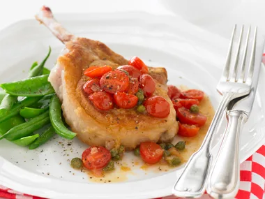 Pork cutlets with tomato and capers