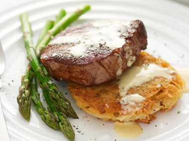 Steak with mustard sauce and crisp potato cakes