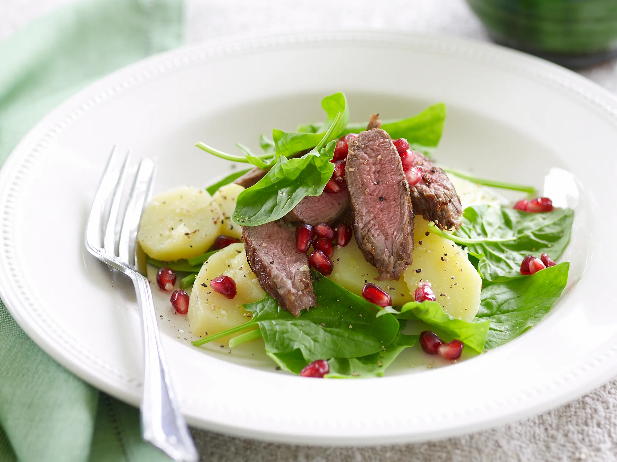 Warm lamb, potato and pomegranate salad