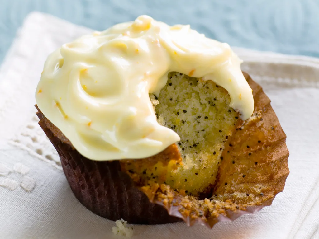 Poppyseed cupcake with orange frosting