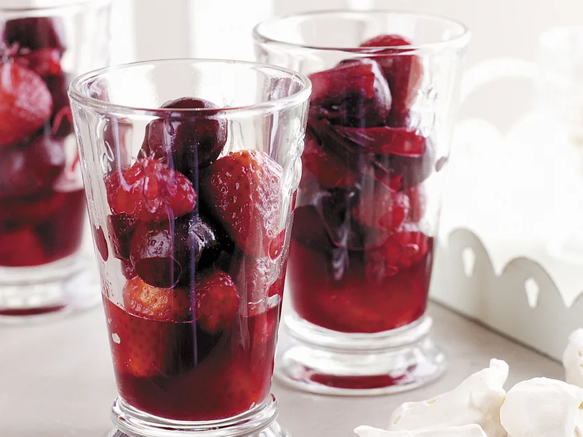 Red fruit salad with vanilla bean meringues