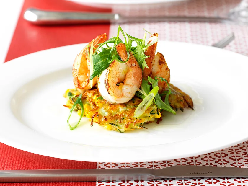 Zucchini cakes with lemon prawns