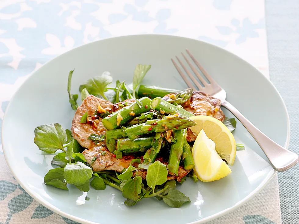 Thin beef steaks with sauteed asparagus
