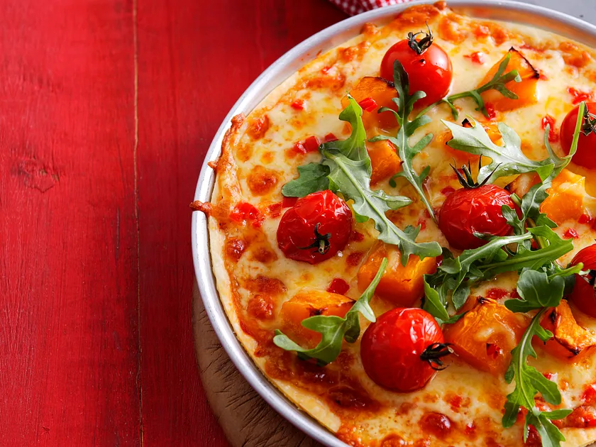 Tomato, pumpkin and rocket pizza