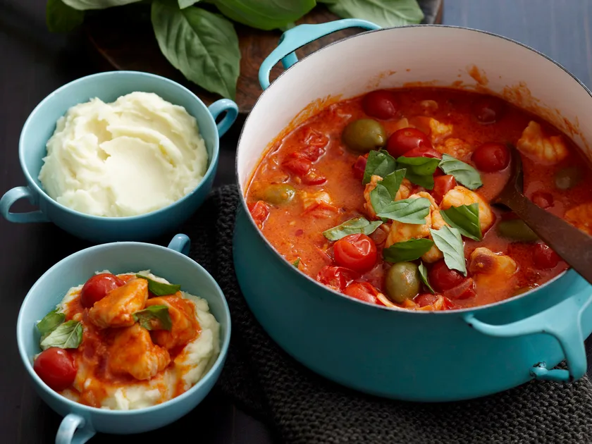 Fish, tomato and olive stew on creamy mash