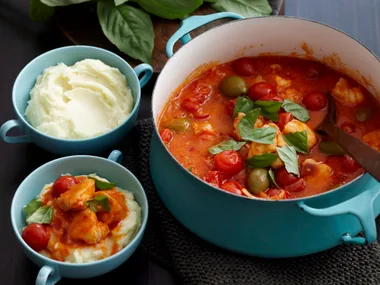 Fish tomato and olive stew on creamy mash