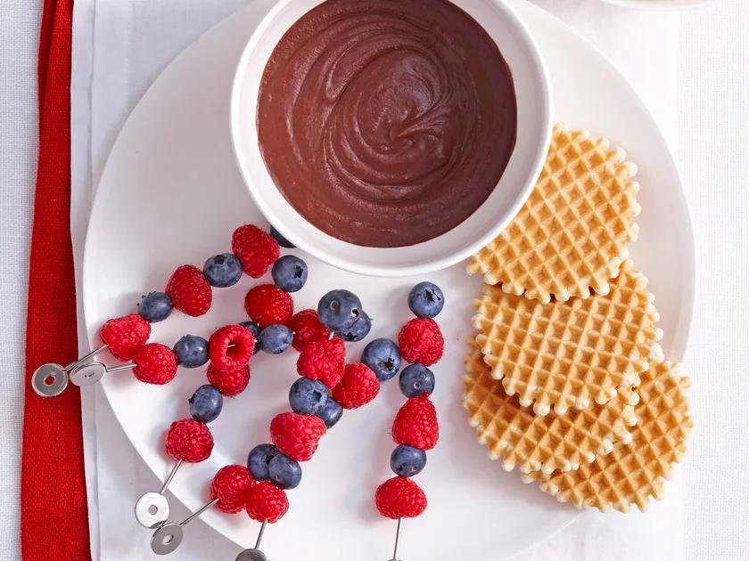 Hazelnut chocolate fondue with berry skewers