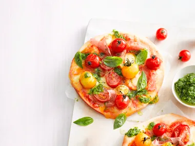 Mini bocconcini, tomato and prosciutto pizzas