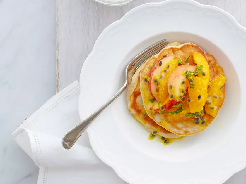 Palm sugar and mango pancakes with fruit salad