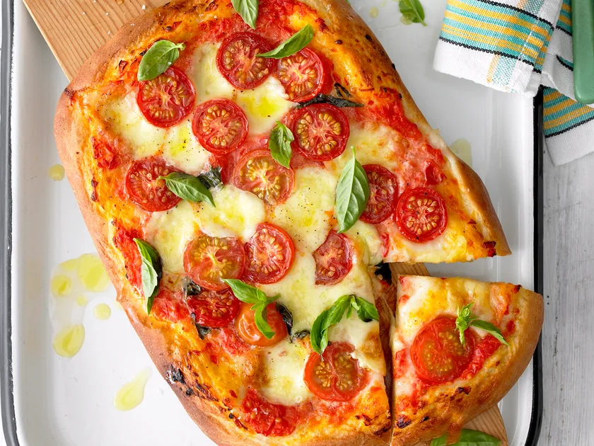 Cheesy margherita pizza with homemade dough recipe
