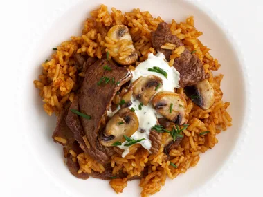 Red pilaf with beef and mushrooms