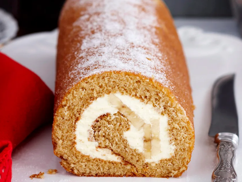 Treacle sponge roll with banana and cream