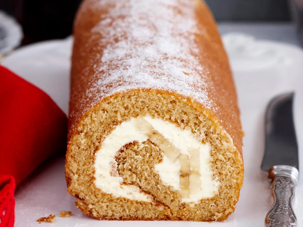 Treacle sponge roll with banana and cream