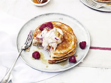 Buttermilk pancakes with raspberry ricotta and maple syrup