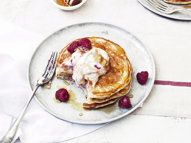 Buttermilk pancakes with raspberry ricotta and maple syrup