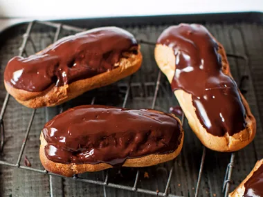 Chocolate eclairs filled with white chocolate cream