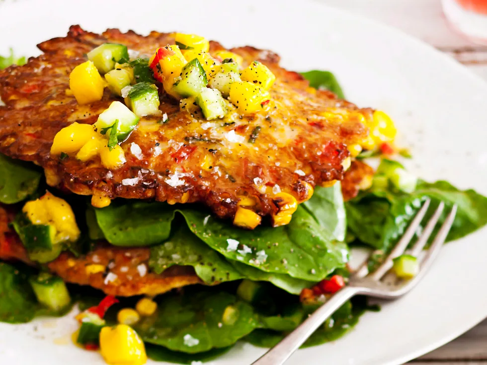 Corn fritters with mango salsa and rocket