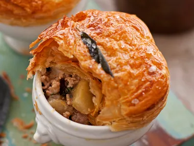 Pork and pear pot pies with potato and pea mash