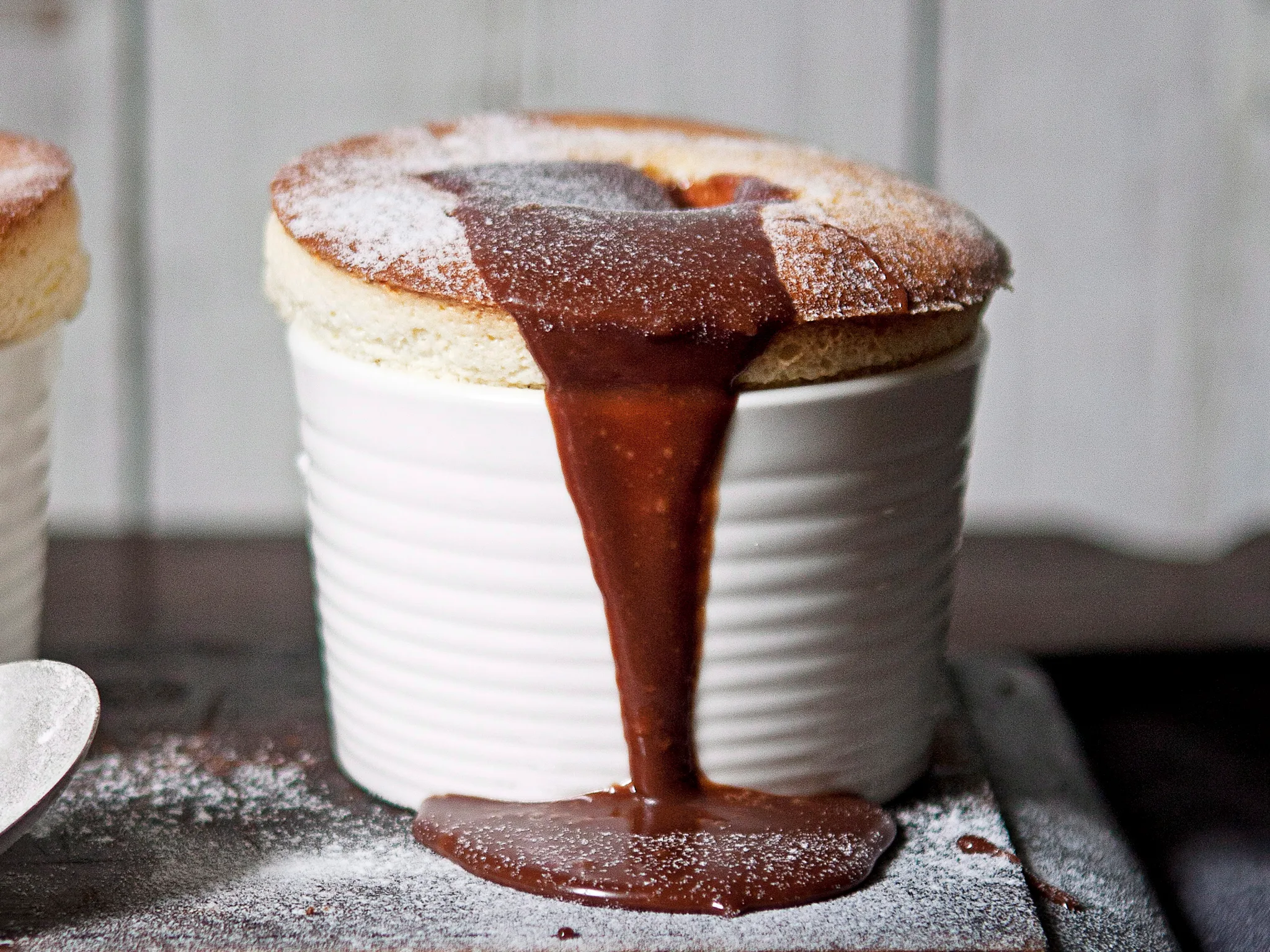 White chocolate soufflis with milk chocolate sauce