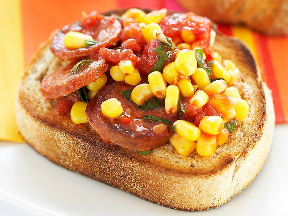 Fried chorizo with tomatoes and corn