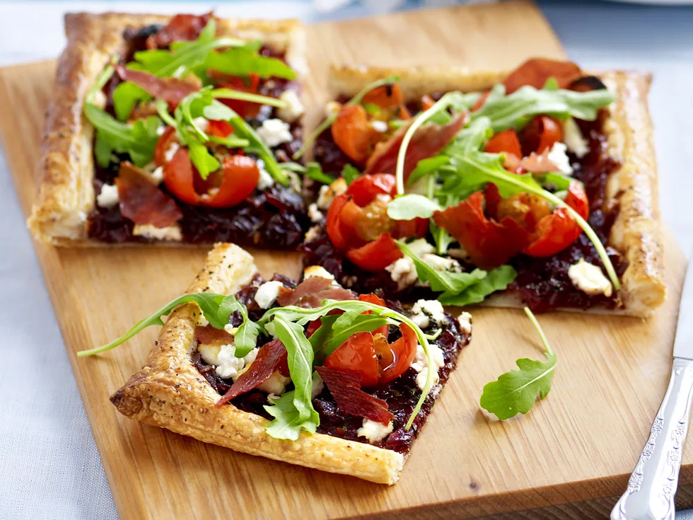 onion tart with rocket and prosciutto