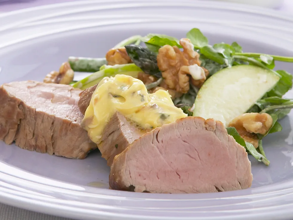 pork fillet with garlic anchovy butter and waldorf salad