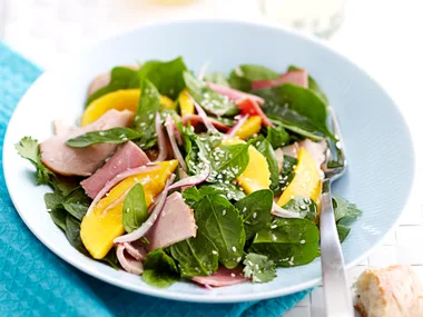 Cold turkey and ham salad with mango and honey dressing