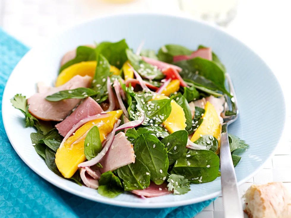 Cold turkey and ham salad with mango and honey dressing