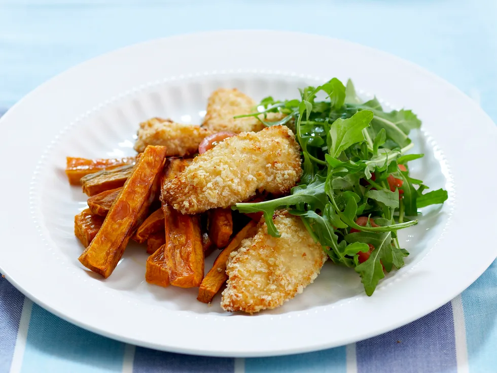 Crisp parmesan chicken with kumara strips