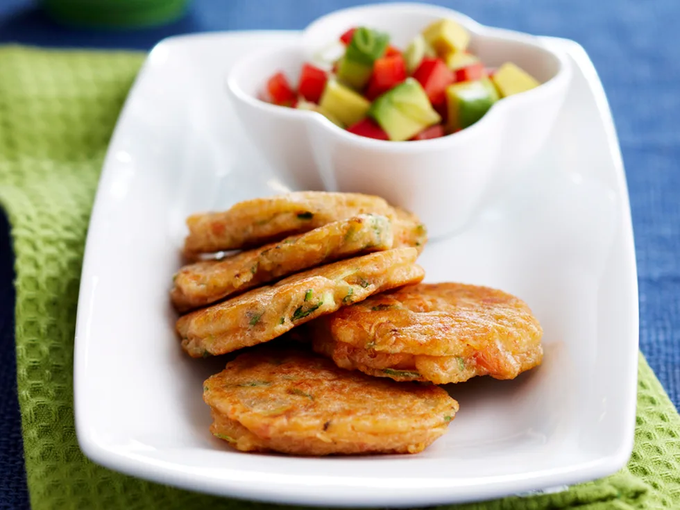 Salmon and zucchini fritters with avocado salsa