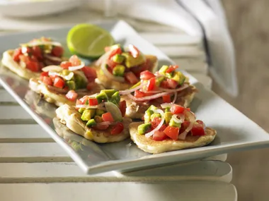 Spicy corn and fish fritters with avocado salsa