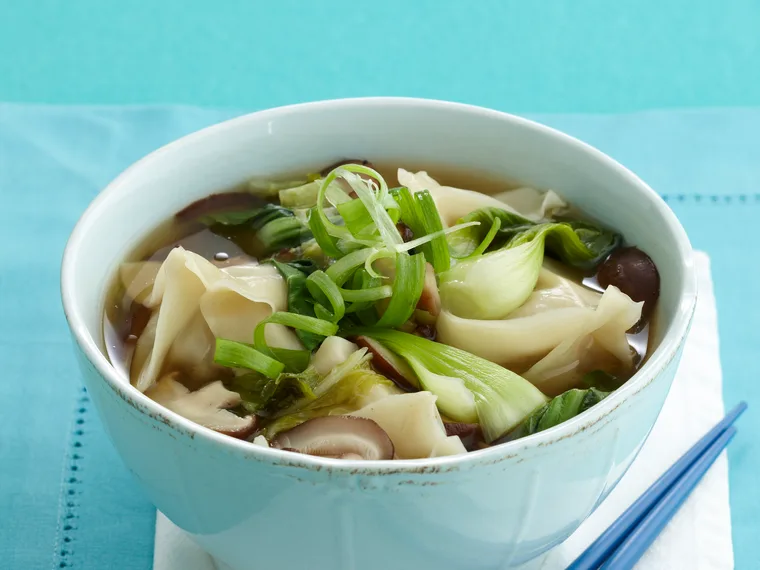 Steamed pork dumplings in chicken broth