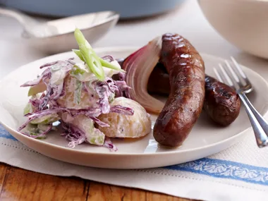 Baked sausages with potato cabbage salad