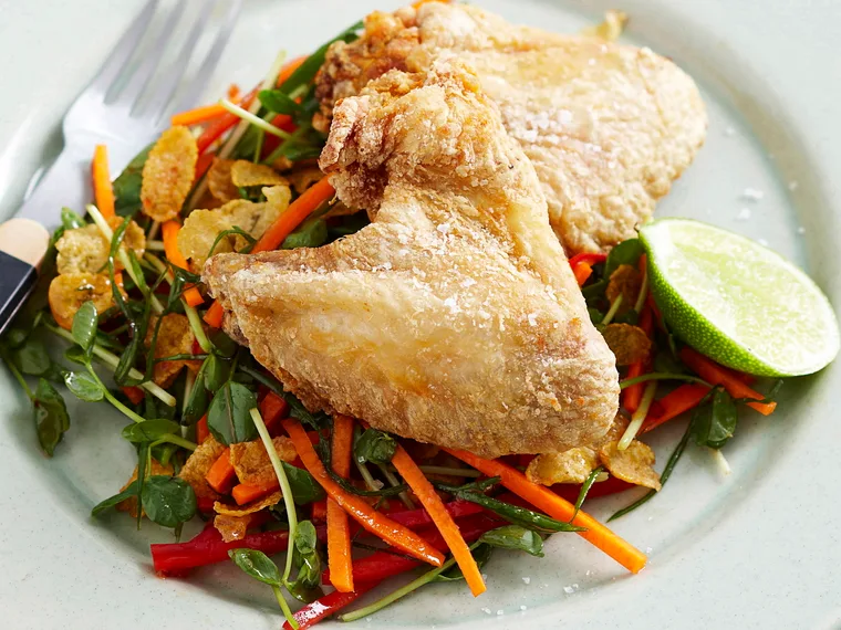Crispy chicken wings and shredded cornflake salad