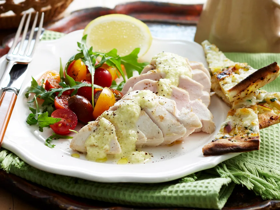 Garlic chicken with tomato salad