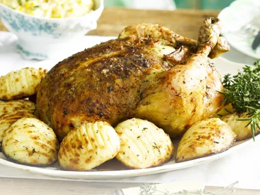Roast lemon and herb chicken with hasselback spuds
