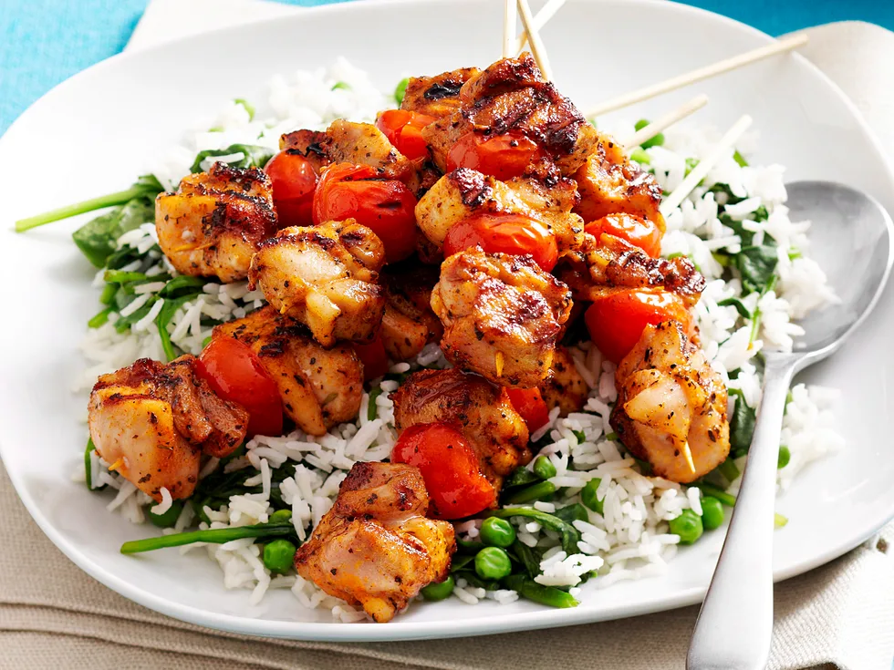 Cajun chicken skewers with green rice