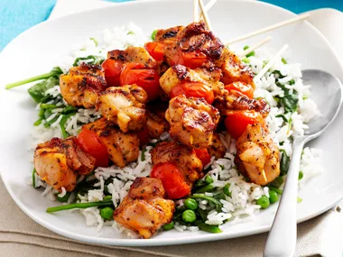 Cajun chicken skewers with green rice
