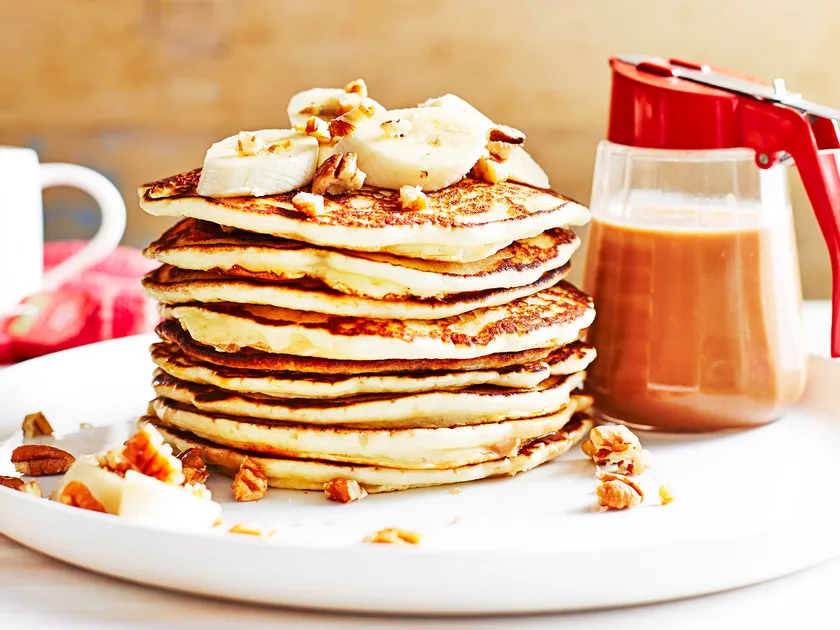 Pancakes with bananas and hot pecan sauce