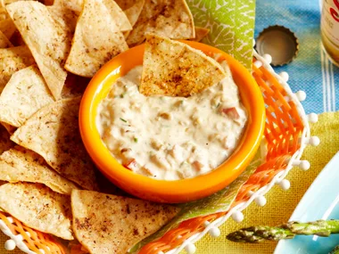 Warm cheese dip and tortilla chips